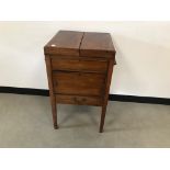 A George III mahogany dressing cabinet, 79cm high, AF, with double flaps to upper and slide up