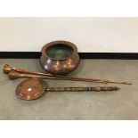 A vintage Middle Eastern copper pot, 50cm diameter, together with a Victorian copper bed warming pan