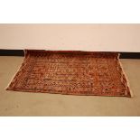 A late 19th century Turkomen rug, worn, 122cm by 82cm