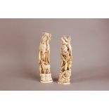 A pair of late Meiji period Japoanese carved ivory figures of immortals, 32cm and 31cm (2)