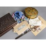 A collection of buttons, gloves and textiles, first half 20th century, the buttons in a wooden