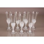 A set of six second half 20th century Daum Glass Champagne flutes, 21cm, together with another