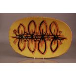 A c1970s large terracotta centrepiece dish, 57cm wide, stamped to underside P. Begley RCA