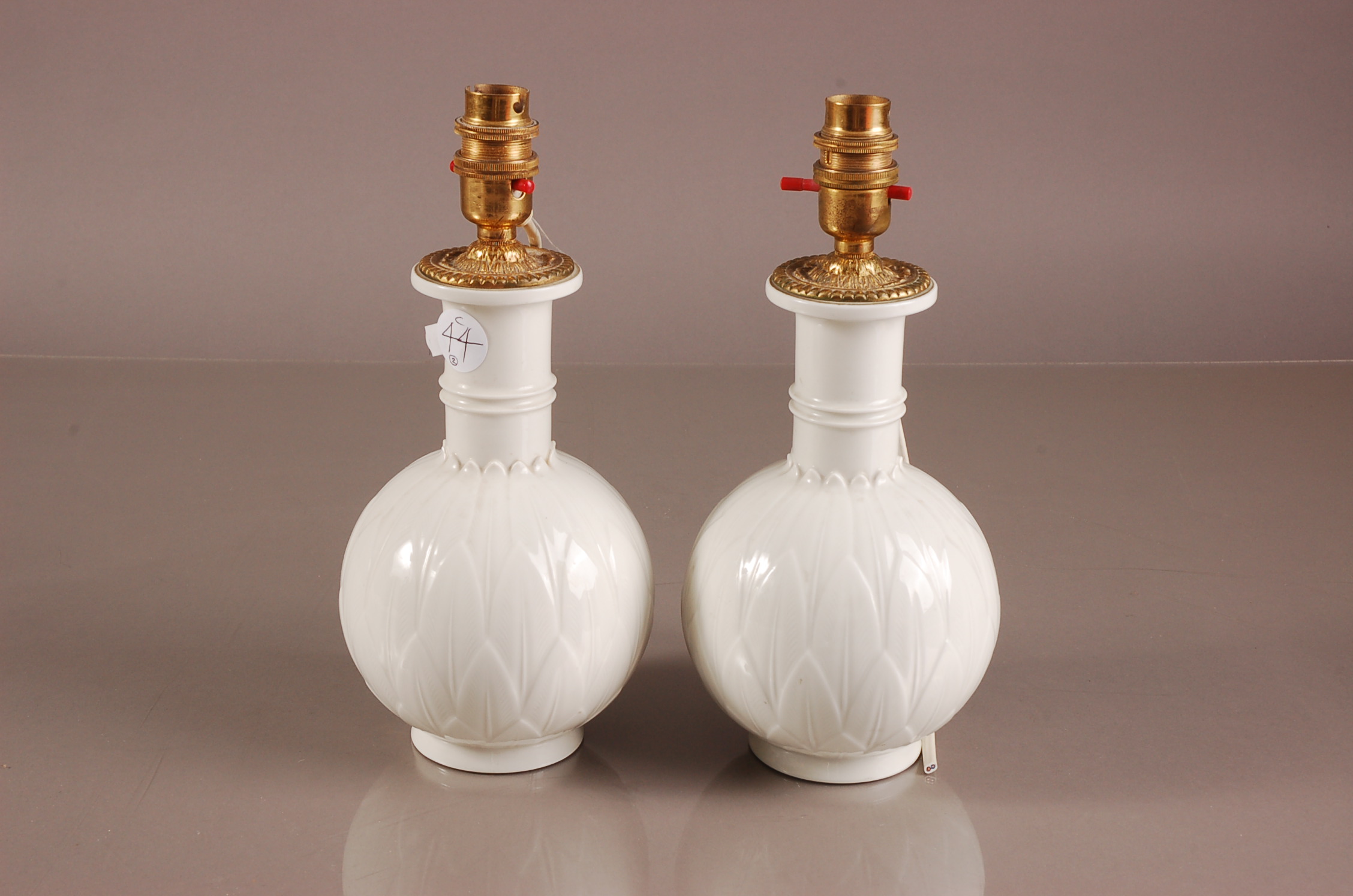 A pair of second half 20th century Royal Copenhagen porcelain lamp bases, 26cm high, blanc de