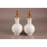 A pair of second half 20th century Royal Copenhagen porcelain lamp bases, 26cm high, blanc de
