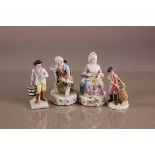 Four 19th century German porcleain figures, AF, including a lady and a gentleman sat on chairs, a