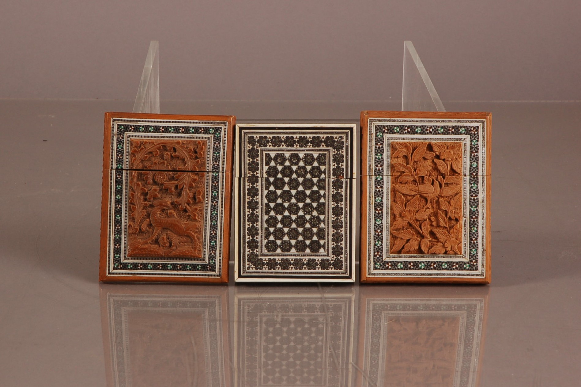 Three late 19th and early 20th century Middle Eastern calling card cases, one Sadeli exmaple,