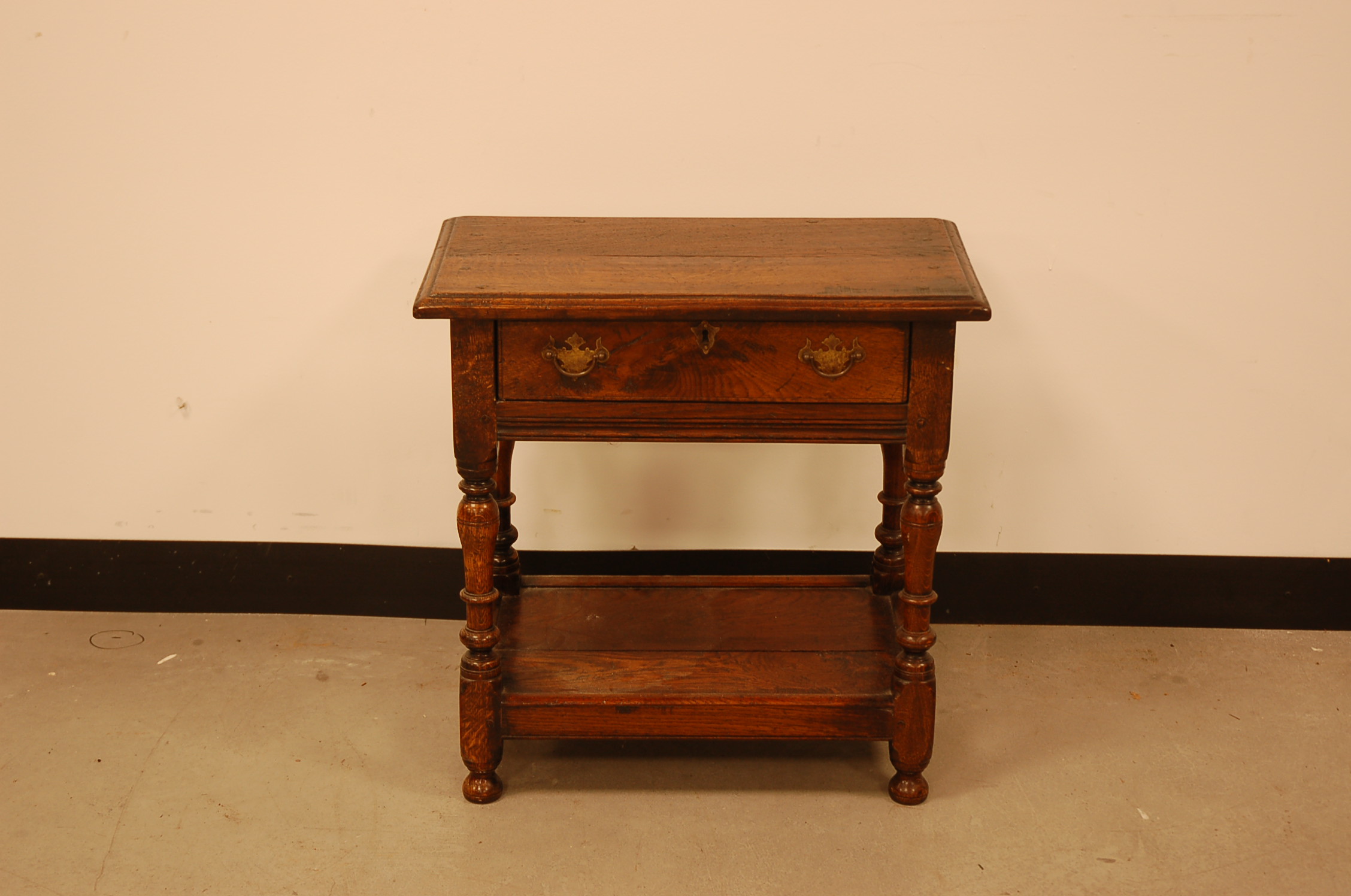 A 19th century and later small table or stool, 56cm wide, drawer liner appears to have been replaced