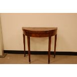 A 19th century mahogany and inlaid demi-lune card table, 78cm wide, on casters