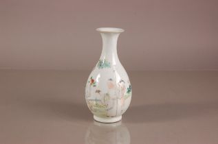 A 20th century Chinese porcleain bottle vase, 23cm high, some wear to decoration, four character