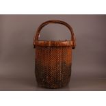 A vintage Chinese market sellers basket, 60cm high, with writing to handles, some sign of woodworm