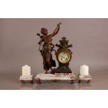 An early 20th century French mantle clock, 49cm high, the spelter and brass figure and clock mounted