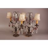 A pair of first hlaf 20th century lamp bases, two branch with applied glass lustres and pendants,