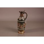 A late Victorian Doulton stoneware ewer, 30cm, having applied silver mount and hinged lid by James
