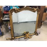 A 19th century gilt wood over mantle mirror, AF, 136cm wide and 140cm high, finial decoration loose,