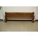 A large Victorian heavy pew, 259cm wide, with some evidence of woodworm