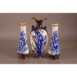 A restored Douton Burslem pottery vase, 34cm, together with a pair of similar Royal Doulton vases,