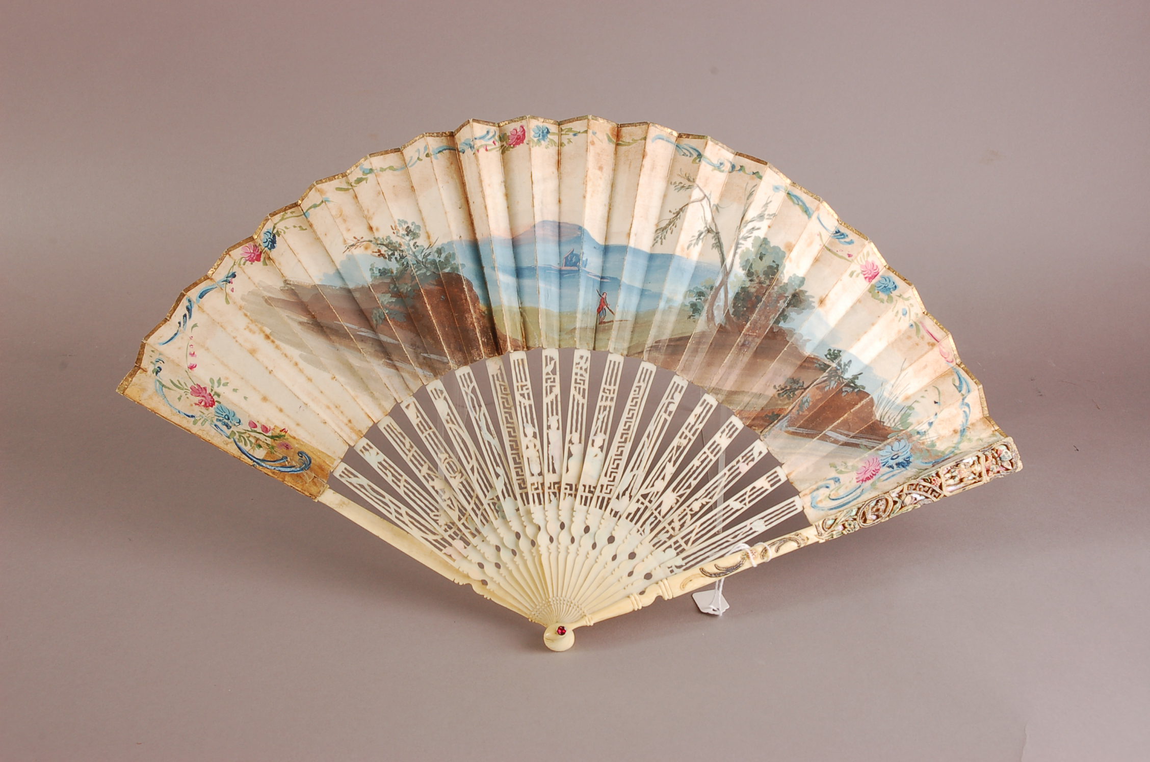 A nice 18th century French carved ivory and paper leaf fan, 27cm, finely pierced sticks with figures - Image 2 of 2