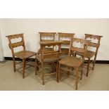 A set of six mid-20th century church chairs, with bible box to rear