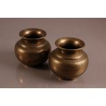 A pair of mid 20th century Middle Eastern brass pots, 13cm (2)