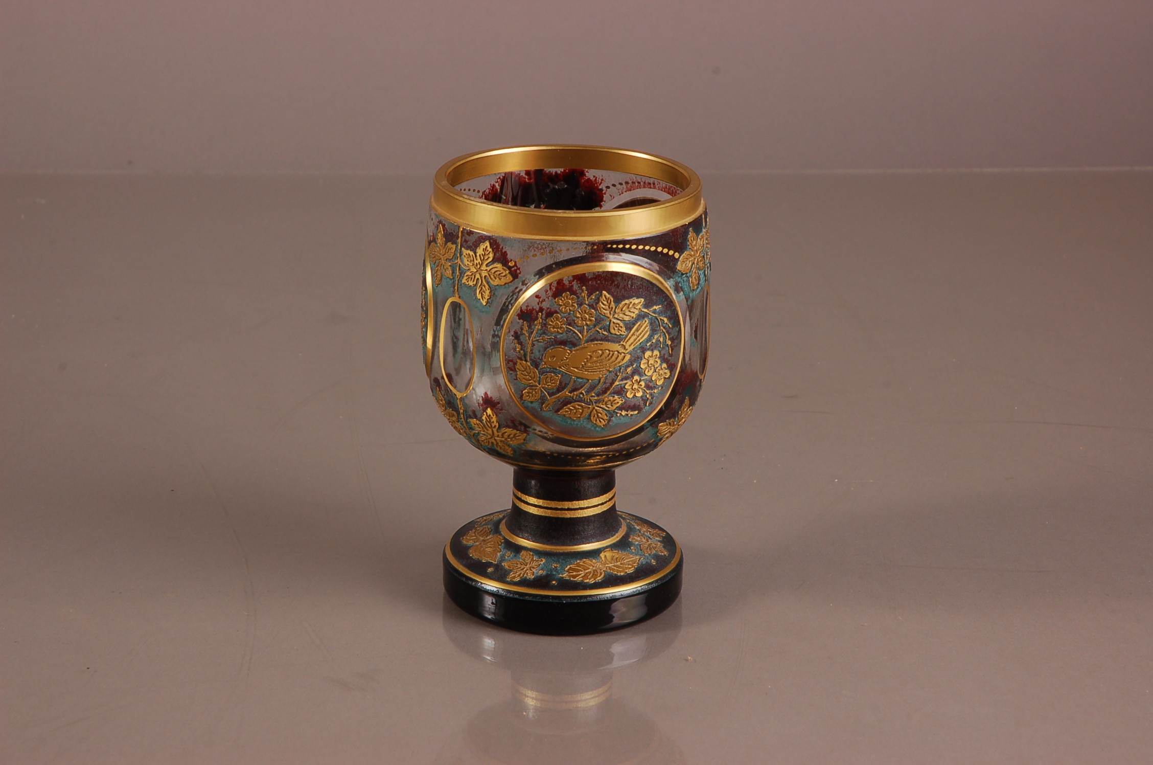 A first half 20th century Bohemium flash and cut glass goblet, 14.5cm, in the Moser for Karlsbad