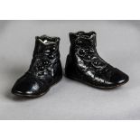 A pair of black glace leather child's button boots, early 20th century with scalloped button trim