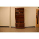 A first half 20th century mahogany stacking bookcase, 206cm high and 89cm wide, with six glazed