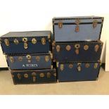Six vintage travel trunks