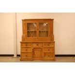 An associated late 19th or early 20th century pine dresser, AF, 140cm wide and total height 169cm,