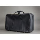 A modern Ferrari black leather suitcase, rectangular, 70cm wide and 40cm high, some wear and