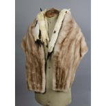 A group of fur items, including four shawls, two coats from the National Fur Co, another fur coat, a