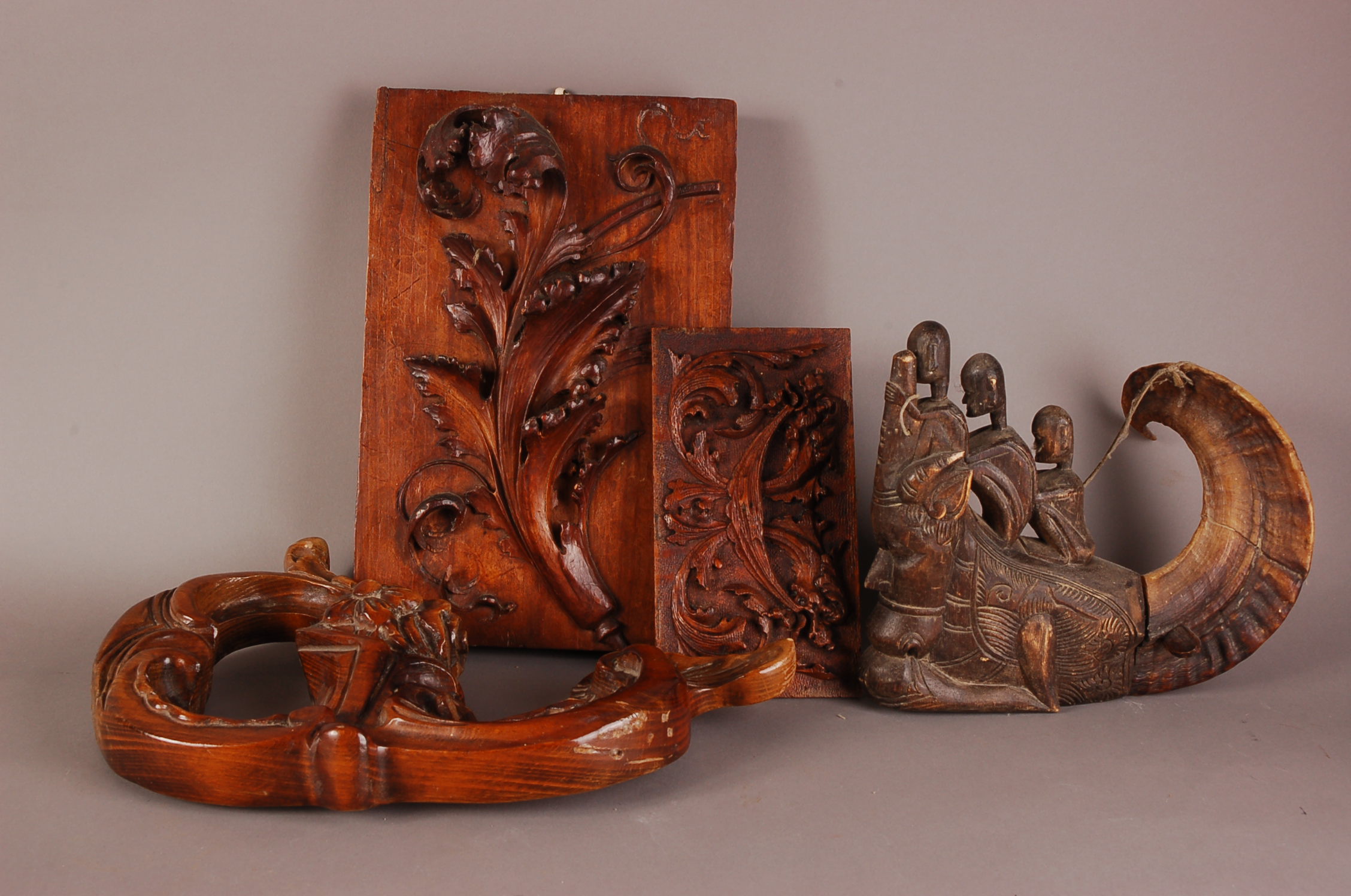 Four 19th and 20th century carved wooden items, including a tribal style soft wood carving with