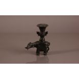 An early 20th century Chinese bronze incense burner, 15.5cm, modelled as an elephant supporting a