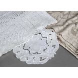 A large collection of textiles, predominantly lace and woven table ware, in two boxes