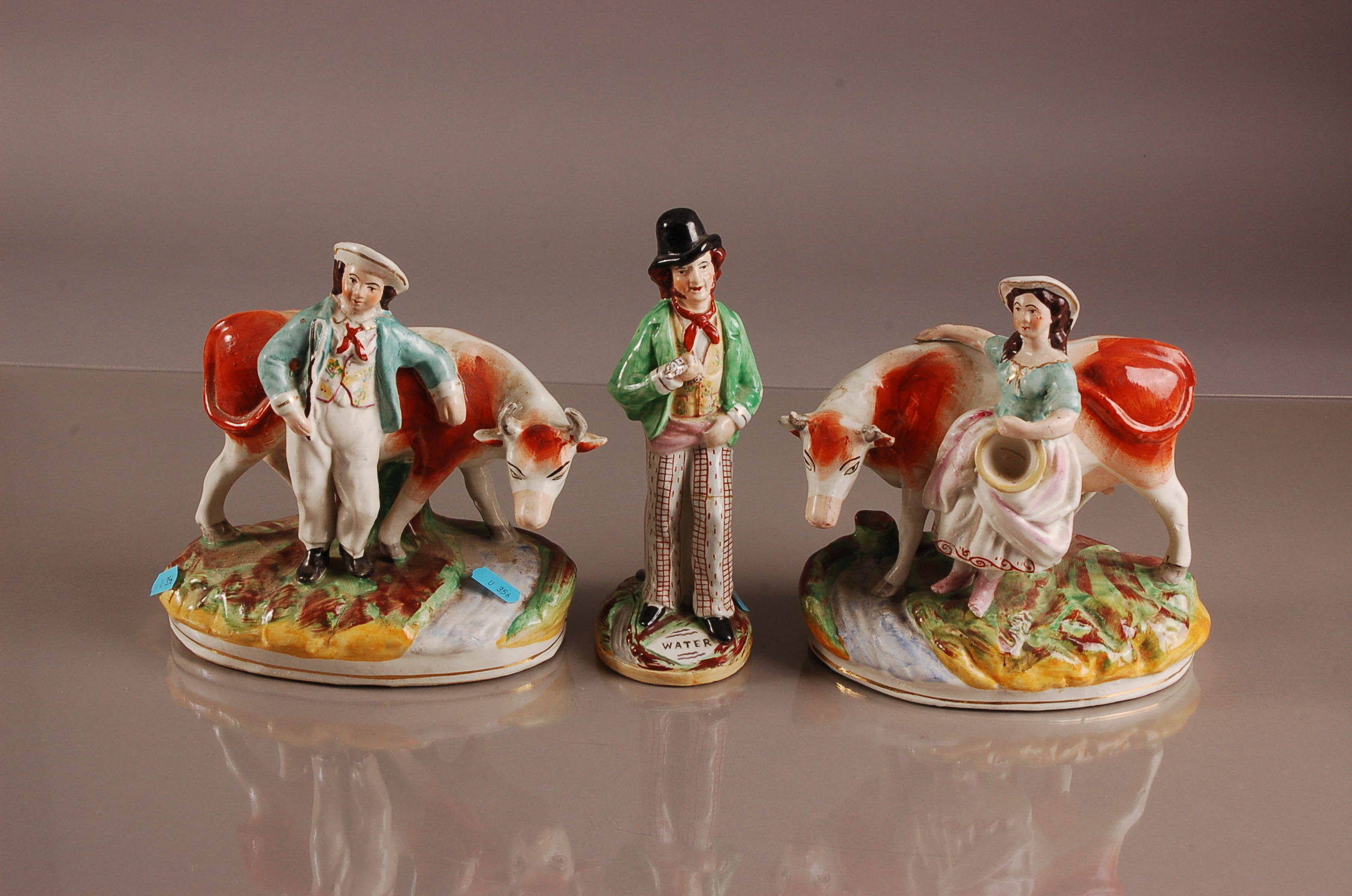 A pair of Victorian Staffordshire pottery figures and another, AF, including a man and a woman