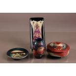 Four second half 20th century Moorcroft pottery items, including a circular box and cover, a small