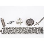 A continental white metal floral decorated bracelet, together with a silver Victorian brooch, a