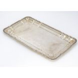 A c1970s century Egyptian white rectangular tray, 17.7 ozt and 32.5cm wide, with leaf design to rim,