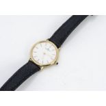 A c1980s Baume & Mercier 18ct gold cased lady's wristwatch, 25mm, blue cabochon stone to winder,