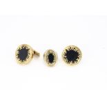 A pair of 18ct gold and onyx cufflinks, of circular design with fixed and snap posts, with