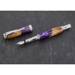 A modern craftsman made fountain pen, the barrel and lid with turned and stained burr elm with