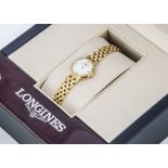 A modern Longines Elegance 18ct gold lady's wristwatch, 19mm circular case on integrated link