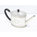 A George III white metal tea pot, in the Regency taste, with engraved design, 18.4ozt