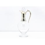 A nice modern silver and glass claret jug from Aquascutum, 30cm H, the bulbous body on spreading