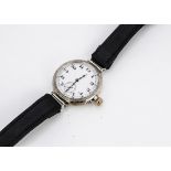 A c1930s silver trench style gentleman's wristwatch, 35mm case with protruding gilt winder, white