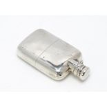 A late Victorian silver hip flask, London 1895, 4.6 ozt, some denting, with removable lower section,