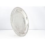 A c1970s Indian silver circular tray, 22.15 ozt, 27.5cm diameter, with flowers to rim, bearing