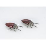 A pair of silver, marcasite and carnelian beetle brooches, 4.5cm x 1.8cm, 27g