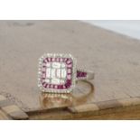 A continental white metal ruby and diamond Art Deco style tablet ring, with central diamond