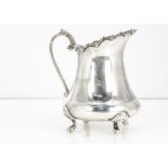 A c1970s Indian silver milk jug, 11 ozt, 12.5cm high, bearing import hallmarks from the London Assay